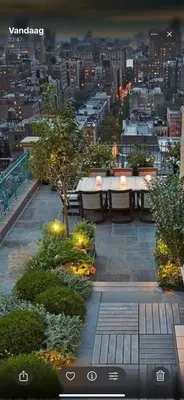 a view of a city skyline with tables and trees at Beautiful Apartment with Panoramic View of center with roof terrace in Brussels