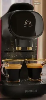 a black coffee maker with two cups of coffee at Beautiful Apartment with Panoramic View of center with roof terrace in Brussels