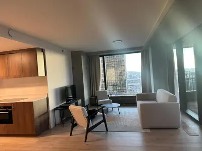 a living room with a view of a building at Beautiful Apartment with Panoramic View of center with roof terrace in Brussels