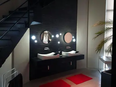 a bathroom with two sinks and a mirror at Watertoren - Chateau d'Eau in Steenokkerzeel