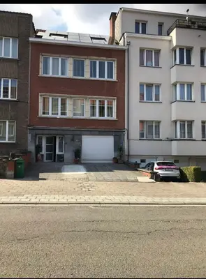 an empty parking lot in front of a building at Tropical Room in Brussels
