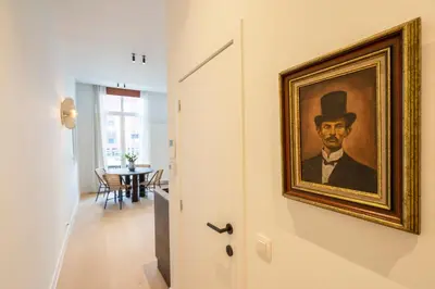 a painting of a man in a top hat on a wall at SHWAY - The Captain's View in Antwerp