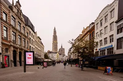 a city street with a clock tower in the distance at SHWAY - The Captain's View in Antwerp