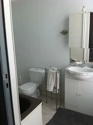 a bathroom with a toilet and a sink at Hotel Residence 18 in Brussels