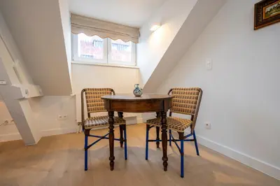 a dining room with a table and two chairs at SHWAY - The Seaman's Sight in Antwerp