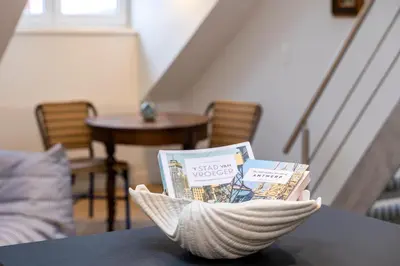 a bowl filled with books sitting on top of a table at SHWAY - The Seaman's Sight in Antwerp