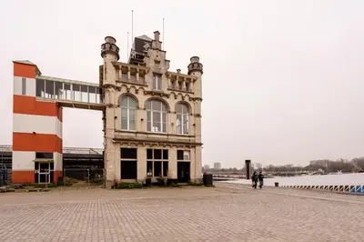 a building on the side of a body of water at SHWAY - The Seaman's Sight in Antwerp