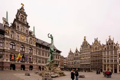 a city square with a statue in front of buildings at SHWAY - The Seaman's Sight in Antwerp