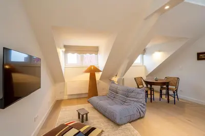a living room with a couch and a table at SHWAY - The Seaman's Sight in Antwerp