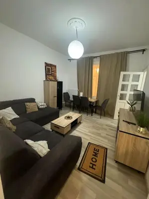 a living room with a couch and a table at Appartement à Bruxelles in Brussels