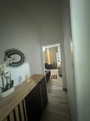 a hallway with a mirror on the wall in a room at Appartement à Bruxelles in Brussels