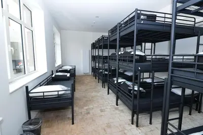 a room with a bunch of bunk beds at Jeugdverblijfcentrum Schotte in Aalst