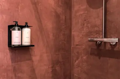 two bottles on a shelf on a wall at Studio Retreat in the Centre of Ghent in Ghent