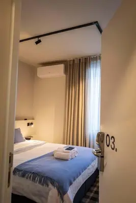 a hotel room with a bed with towels on it at Studio Retreat in the Centre of Ghent in Ghent