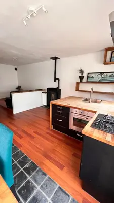 a kitchen with a sink and a stove top oven at Casa Mellow in Ghent