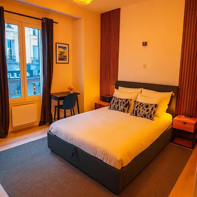 a bedroom with a bed with yellow walls and a window at Brussels City Center Oasis in Brussels
