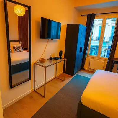 a hotel room with a bed and a mirror at Brussels City Center Oasis in Brussels