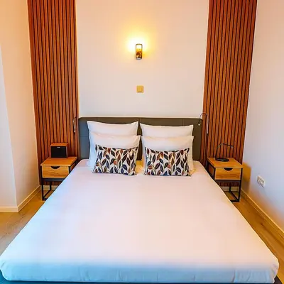 a bedroom with a large bed with two pillows at Brussels City Center Oasis in Brussels
