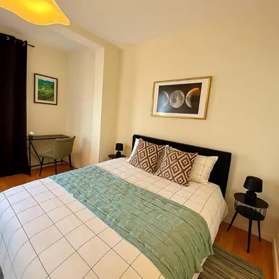 a bedroom with a large bed in a room at Brussels Central City Oasis in Brussels