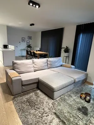 a living room with a couch and a table at Urban Apartment 2 bedroom Brussels City in Brussels