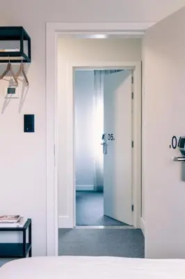 a room with a door leading to a bedroom at Studio for 2 in City of Ghent in Ghent