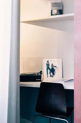 a desk with a black chair in a room at Excellent Studio for Two in Central Ghent in Ghent