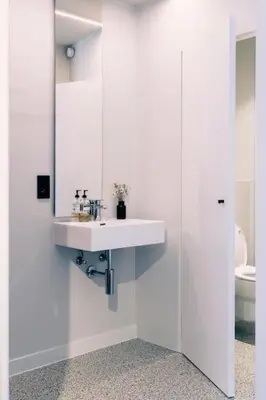 a white bathroom with a sink and a toilet at Excellent Studio for Two in Central Ghent in Ghent
