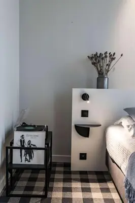 a bedroom with a bed and a vase on the wall at Cozy Studio for Two in Central Ghent in Ghent