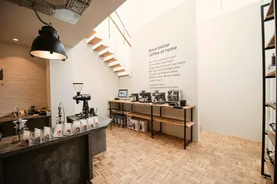 a coffee shop with a counter in a room at Cozy Studio for Two in Central Ghent in Ghent