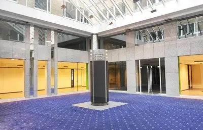 a large building with a black pole in the middle at Le Cocon Studio in Brussels