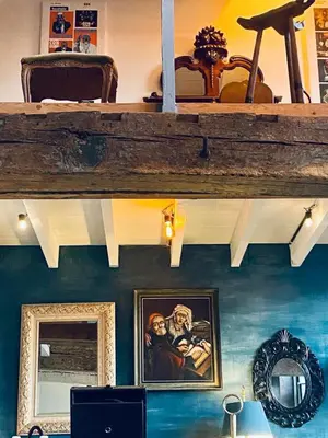 a room with a shelf and a painting on the wall at Mystic's Lodge in Antwerp
