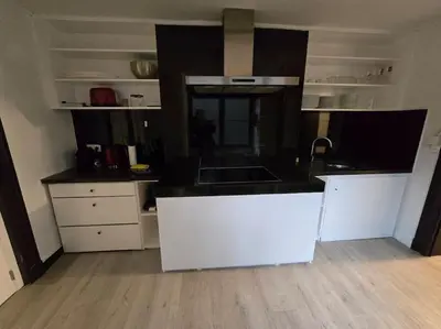 a kitchen with a white island in a room at 8z dreamz 2 in Ghent