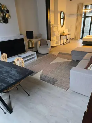 a living room with a couch and a table and chairs at 8z dreamz 2 in Ghent