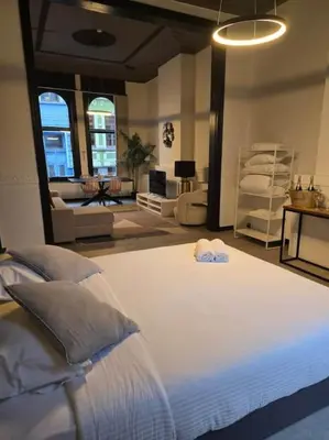 a bedroom with a large white bed with pillows at 8z dreamz 2 in Ghent