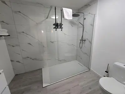 a bathroom with a shower with a glass door at 8z dreamz 2 in Ghent