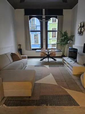 a living room with a couch and a table at 8z dreamz 2 in Ghent
