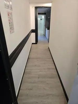 a hallway in an office building with a wooden floor at 8z dreamz 2 in Ghent