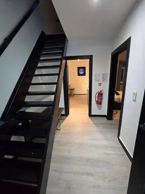 a staircase leading to a hallway with a fire hydrant at 8z dreamz 4 in Ghent