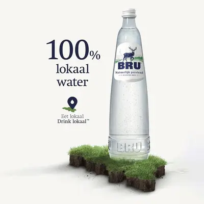 a bottle of bru mineral water on a patch of grass at 8Z Dreamz 3 in Ghent