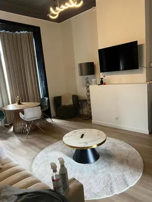 a living room with a couch and a table at 8Z Dreamz 3 in Ghent