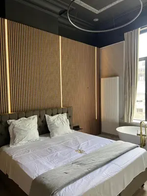 a bedroom with a large bed and a bath tub at 8Z Dreamz 3 in Ghent