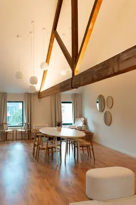 a dining room with a table and chairs at Spacious, newly renovated loft - 107m2 in Sint-Niklaas
