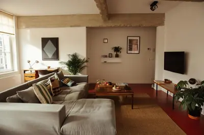 a living room with a couch and a table at A Place Antwerp - Boutique Suites & Flats - Leeuwenstraat 20 in Antwerp
