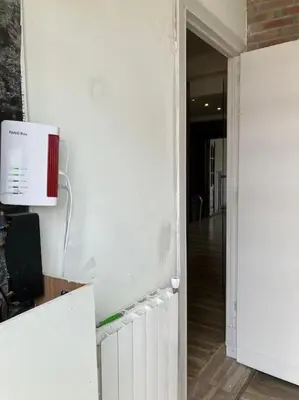an empty room with a white wall and a hallway at Expats House 10 Stabroek Belgium in Stabroek
