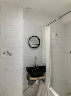 a bathroom with a black sink and a mirror at Expats House 10 Stabroek Belgium in Stabroek