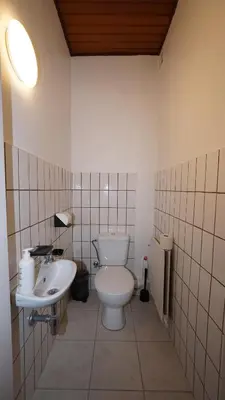 a bathroom with a toilet and a sink at Simon Apartment in Antwerp