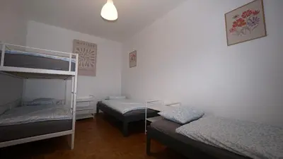 a bedroom with two bunk beds and a ladder at Simon Apartment in Antwerp