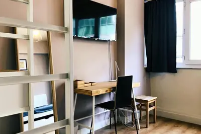 a room with a desk and a chair at Charming little studio in Brussels
