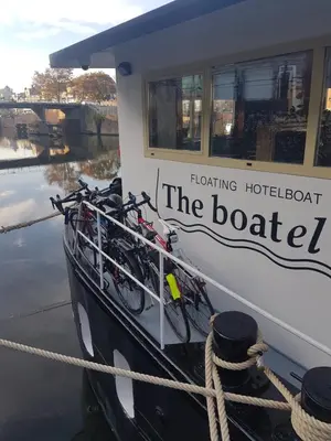 a boat with bikes parked on the side of it at Hotel The Boatel in Ghent