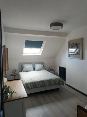 a bedroom with a bed and a skylight at Modern Triplex 140m2 - 4 bedrooms, 1 living room & 2 bathrooms - 8 people in Brussels city in Brussels